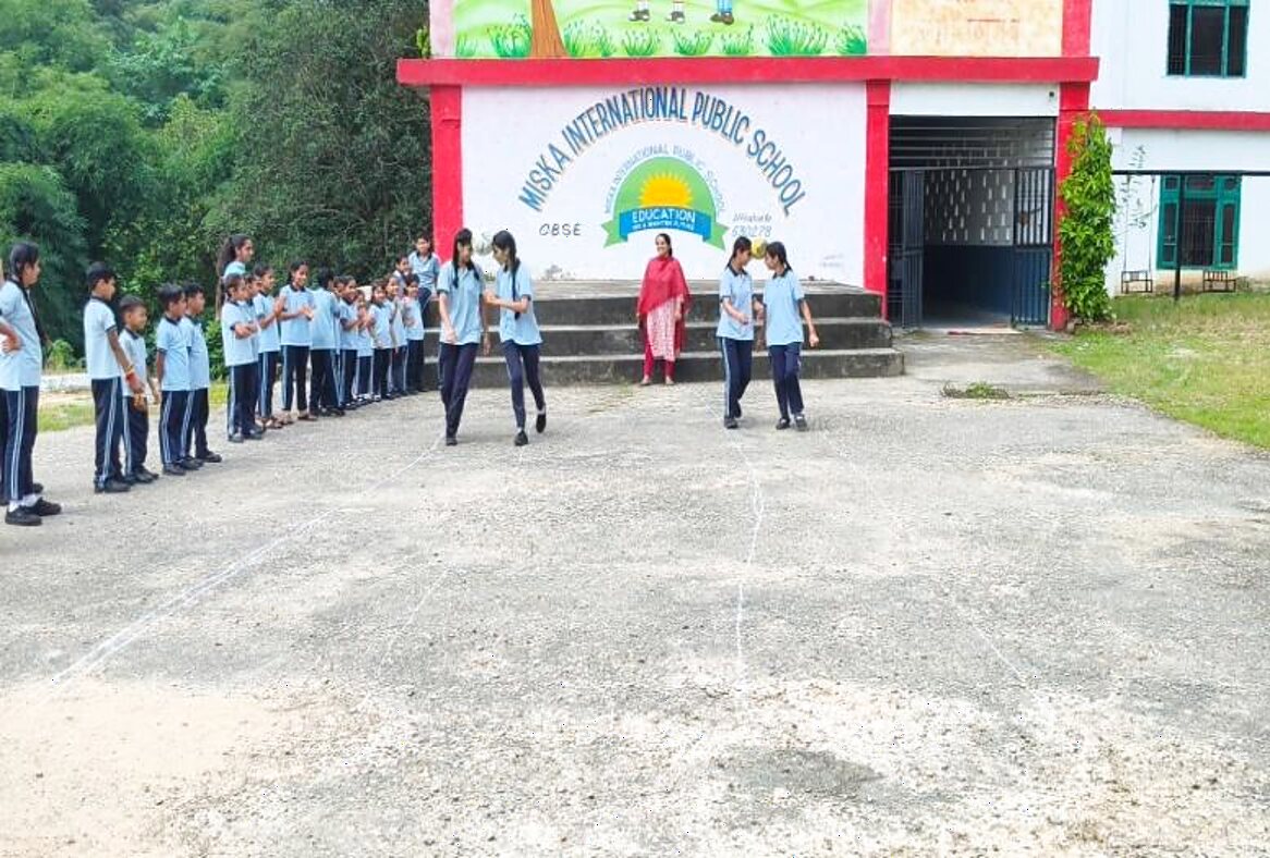 Students lined up outside the MISKA International Public School building